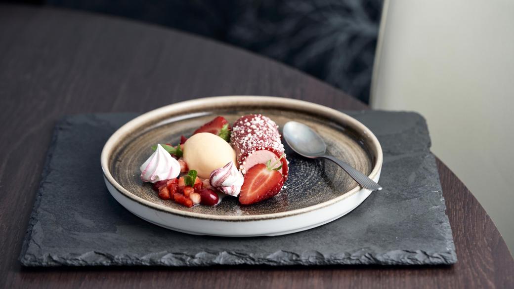 A dessert with strawberries served in the restaurants at Sandy Cove Hotel