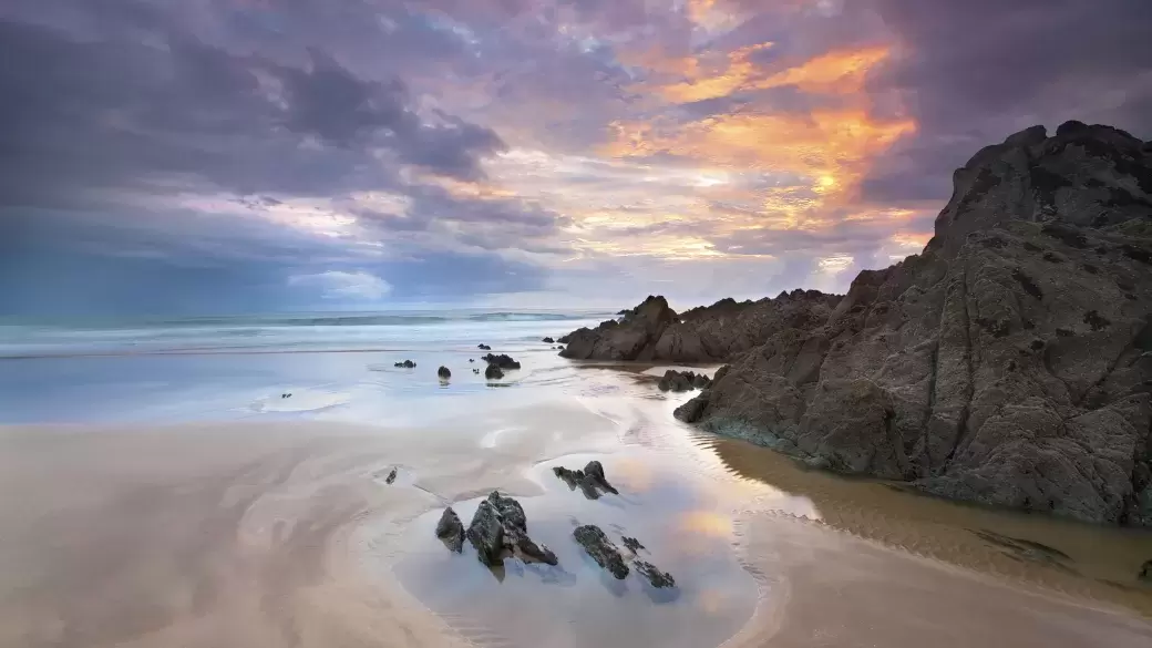 Rock pools at sunset on Croyde Beach in North Devon