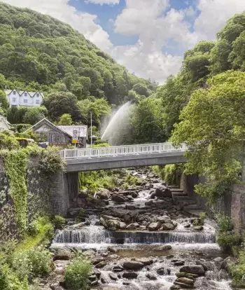 The bridge over the Glen Lyn Gorge in Lynmouth on a sunny day