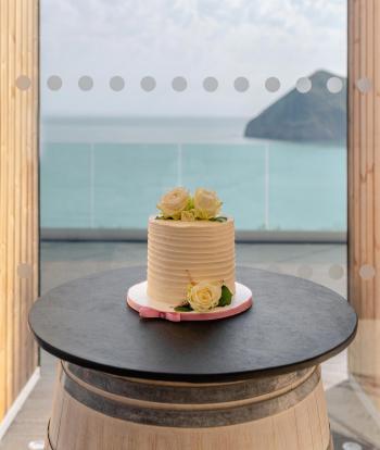 A wedding cake in the window of The Venue, Sandy Cove Hotel