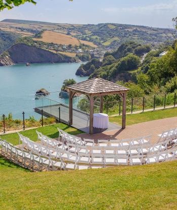 Outdoor wedding seating area overlooking the bay at The Venue, Sandy Cove Hotel