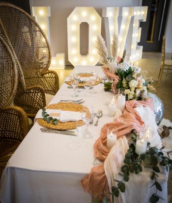 The bride and groom's table with winter decorations inside The Venue, Sandy Cove