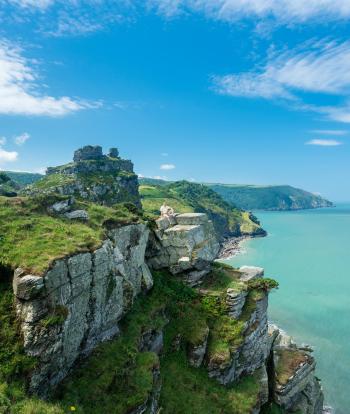 Hiker on the headland in Valley of the Rocks on South West coast path near Lynmouth